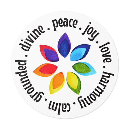 Round sticker with colorful leaf design and motivational words on a white background