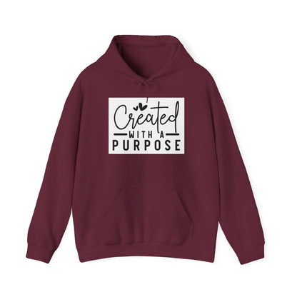 Maroon hoodie with 'Created with a Purpose' text on a white background