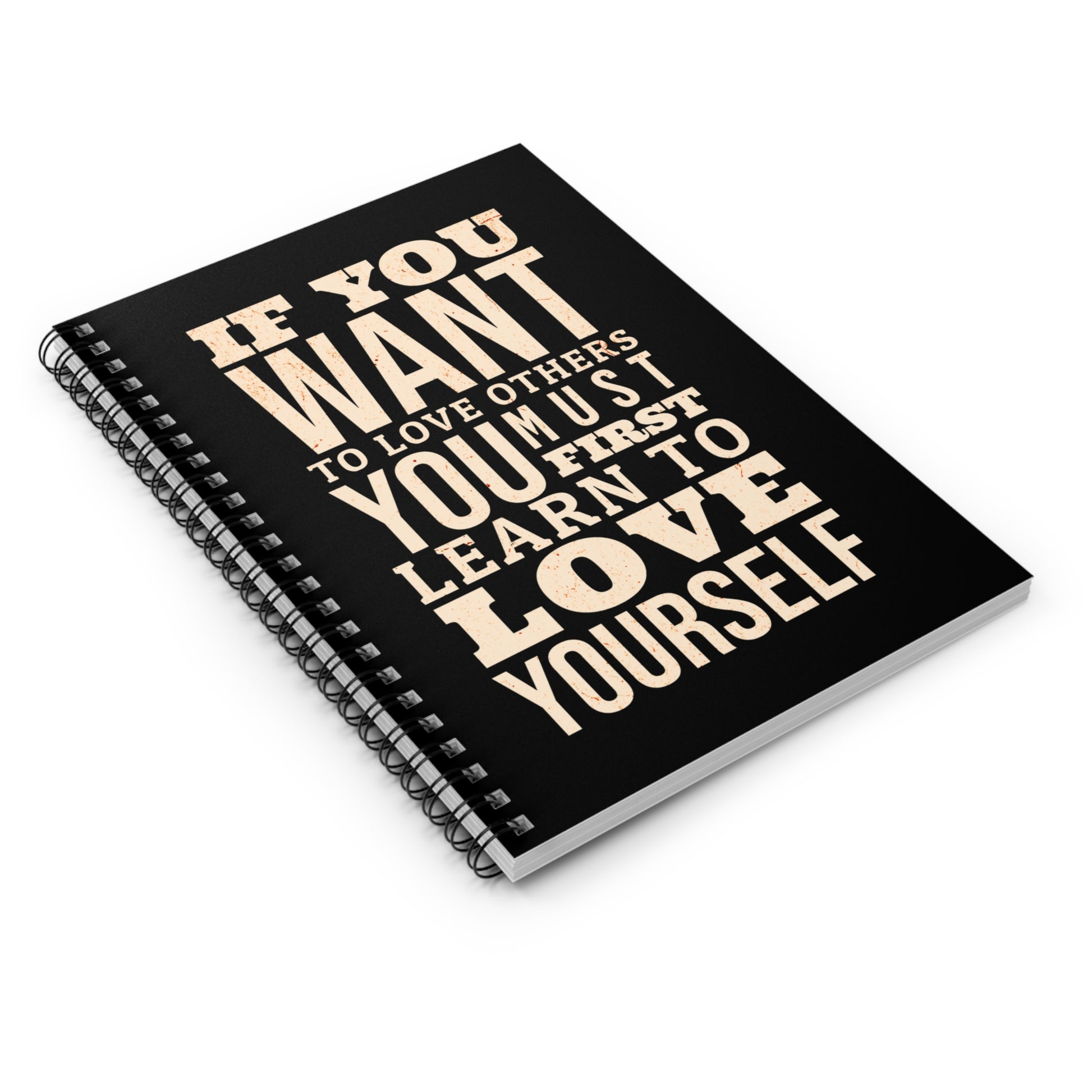 Black notebook with motivational quote on a white background