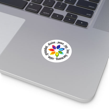 Laptop with a sticker featuring a colorful flower design and text on the palm rest area.