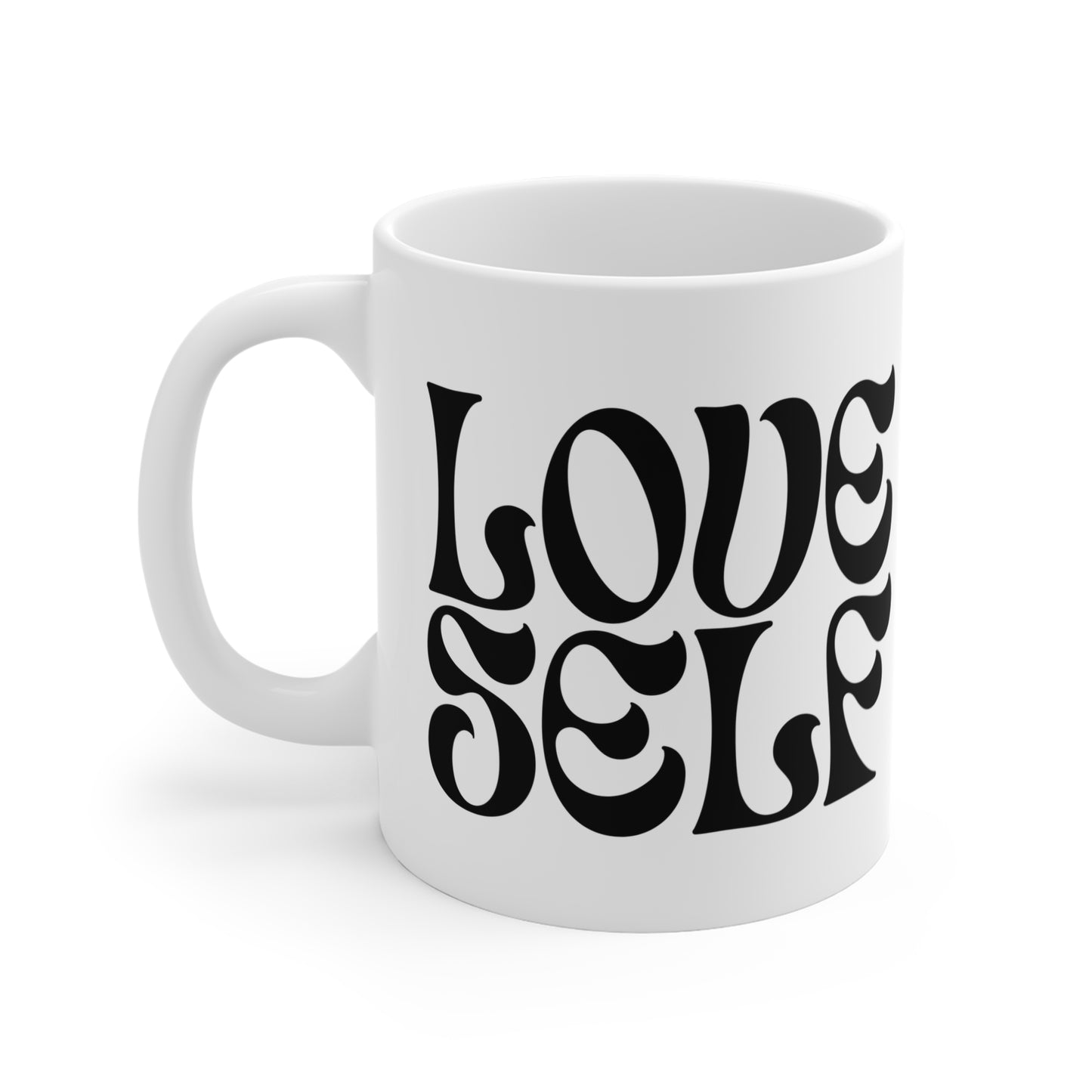 White mug with 'LOVE SELF' text in black on a white background