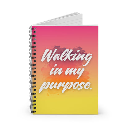 Notebook with 'Walking in my purpose' text on a colorful gradient cover