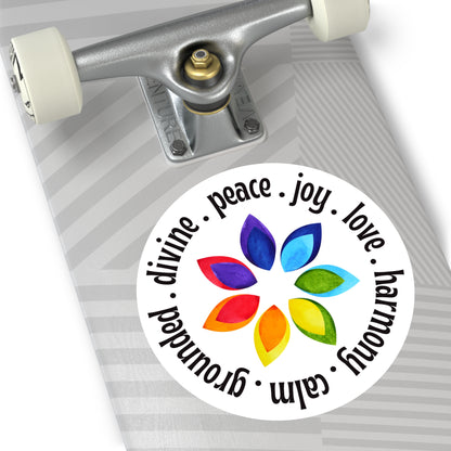 Skateboard with a colorful sticker featuring leaves and text on a white background