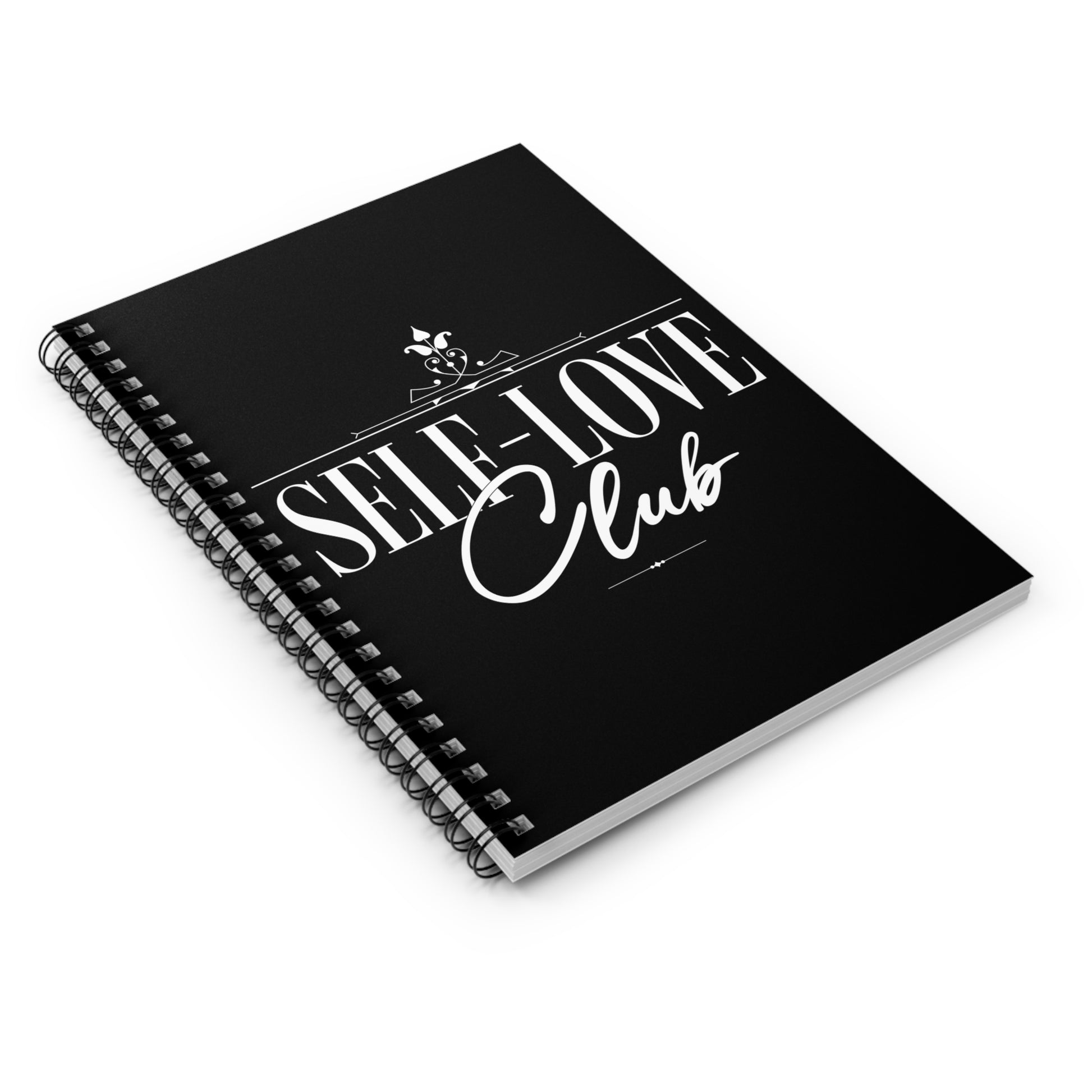 Black notebook with 'Self-Love Club' text on a white background