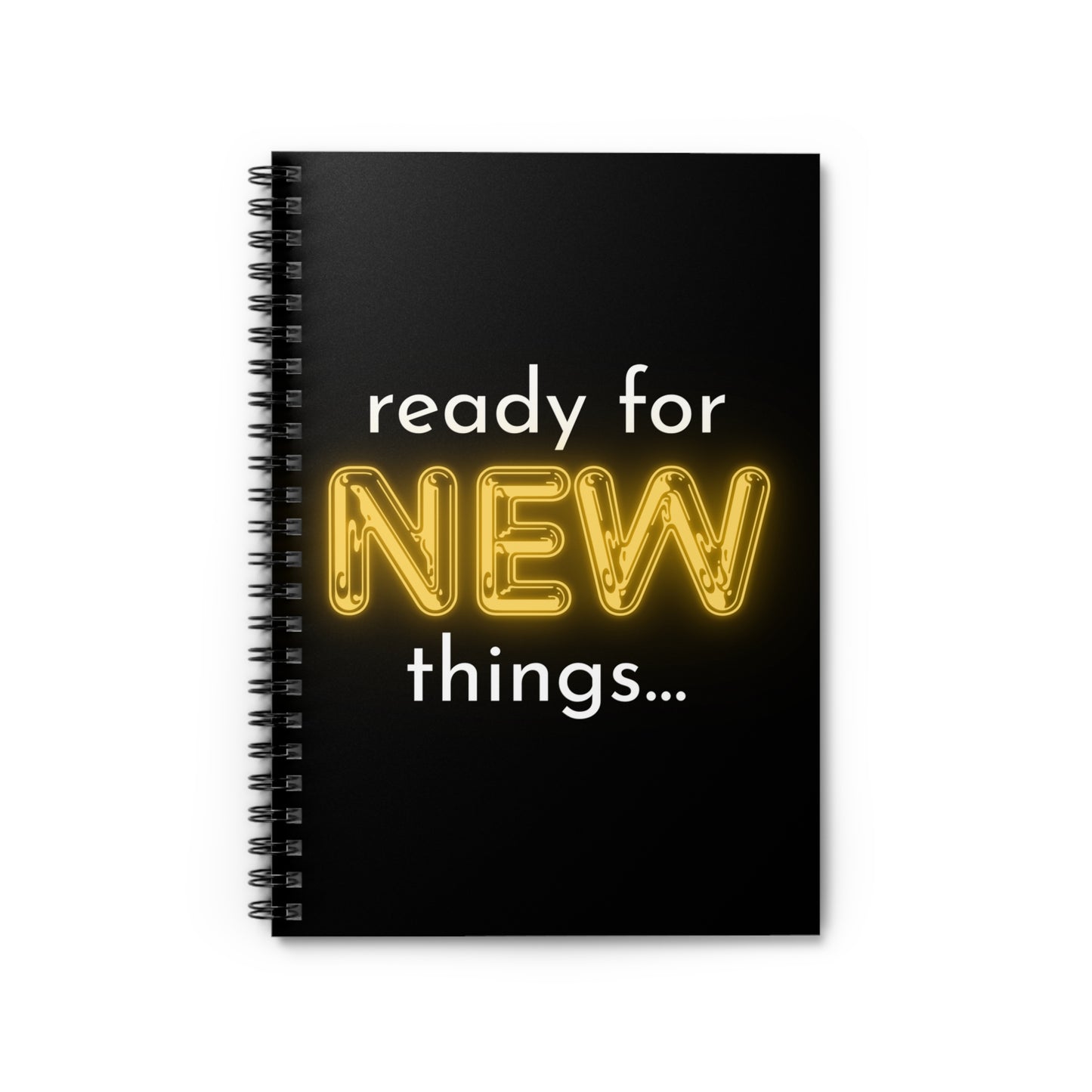 Black spiral-bound notebook with 'ready for NEW things...' text on a white background