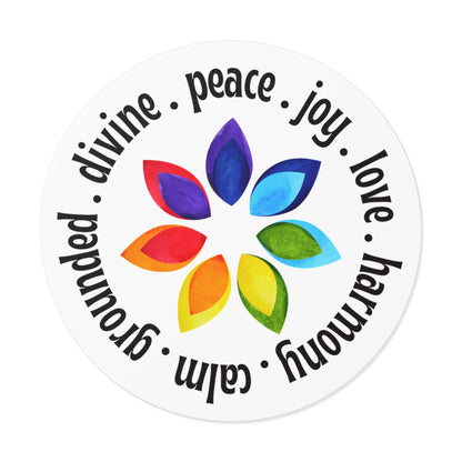 Round sticker with colorful leaf design and motivational words on a white background