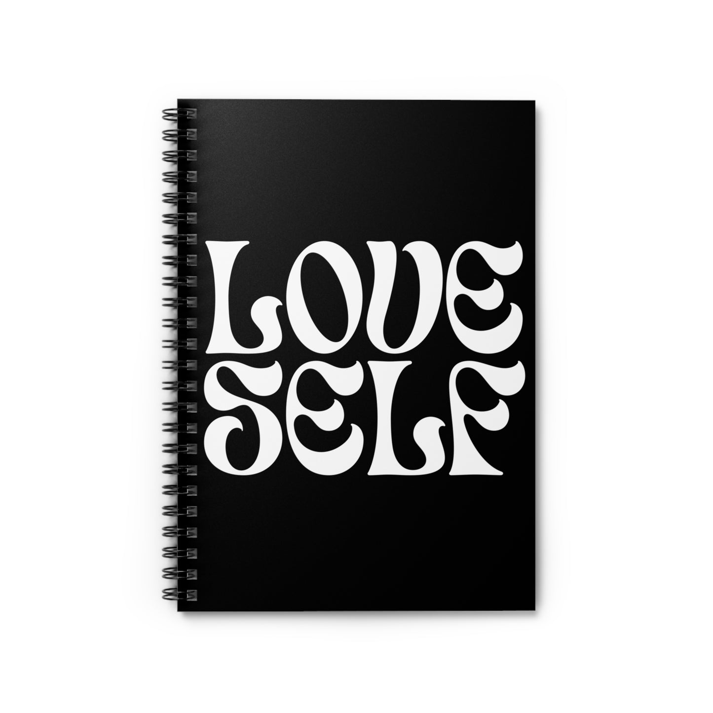 Black notebook with 'LOVE SELF' text on a white background