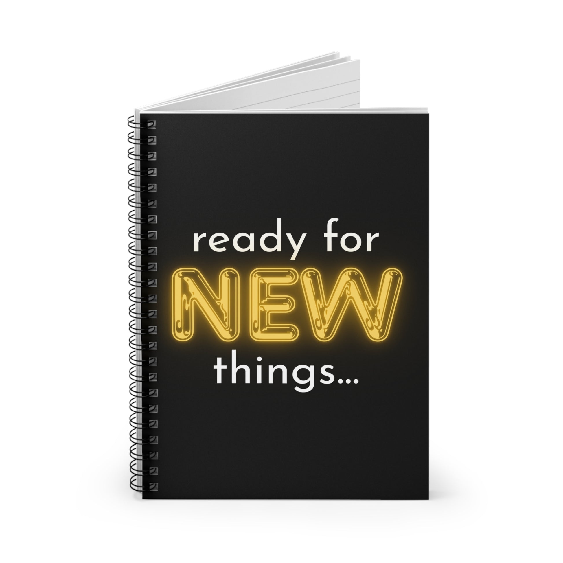 Black notebook with 'ready for NEW things...' text on a white background