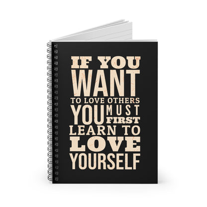 Notebook with motivational quote on a white background