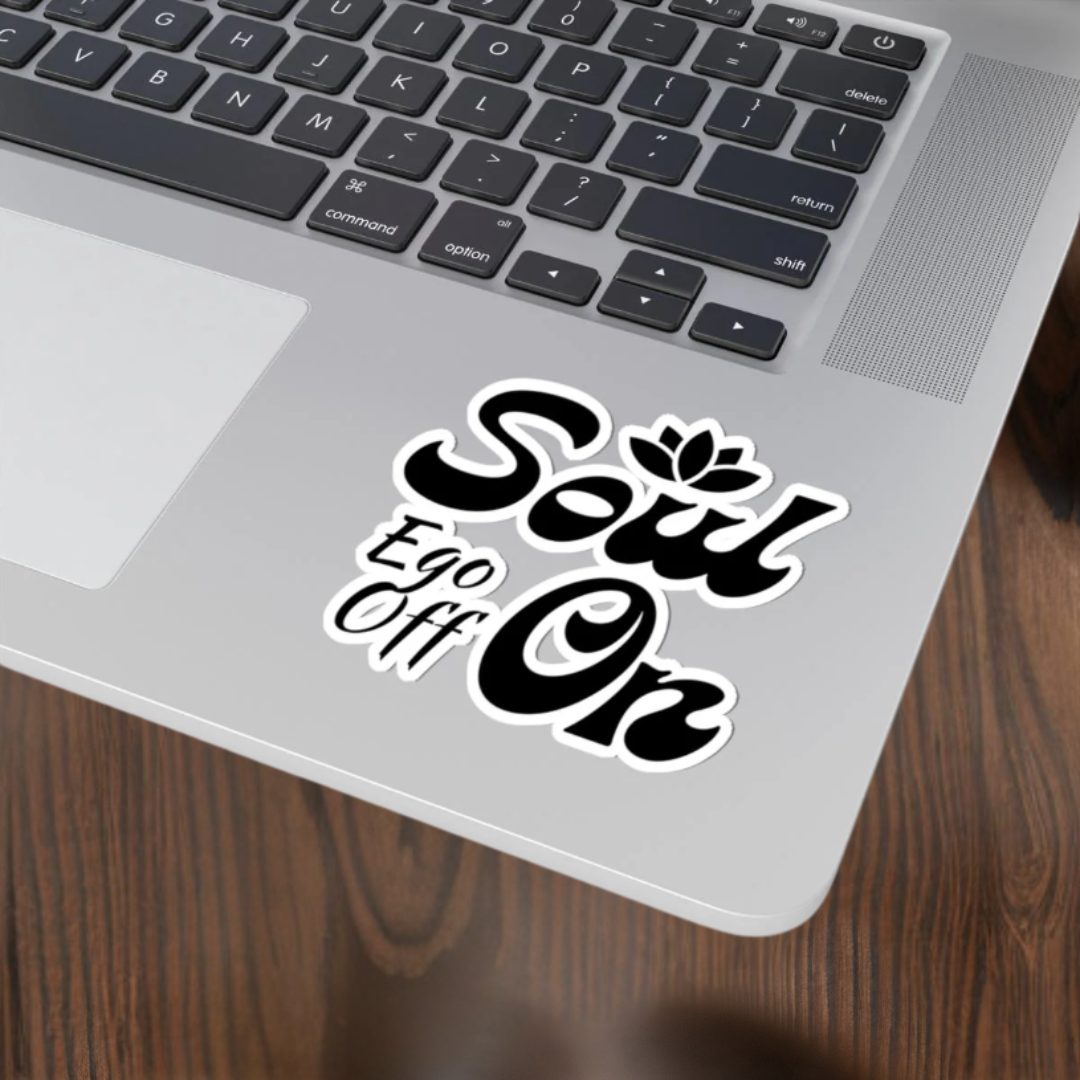 Laptop with a 'Soul Ego Off On' sticker on the palm rest area