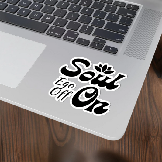 Laptop with a 'Soul Ego Off On' sticker on the palm rest area