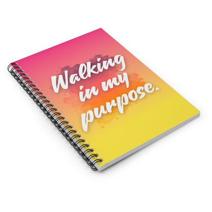 Notebook with 'Walking in my purpose' text on a colorful gradient cover