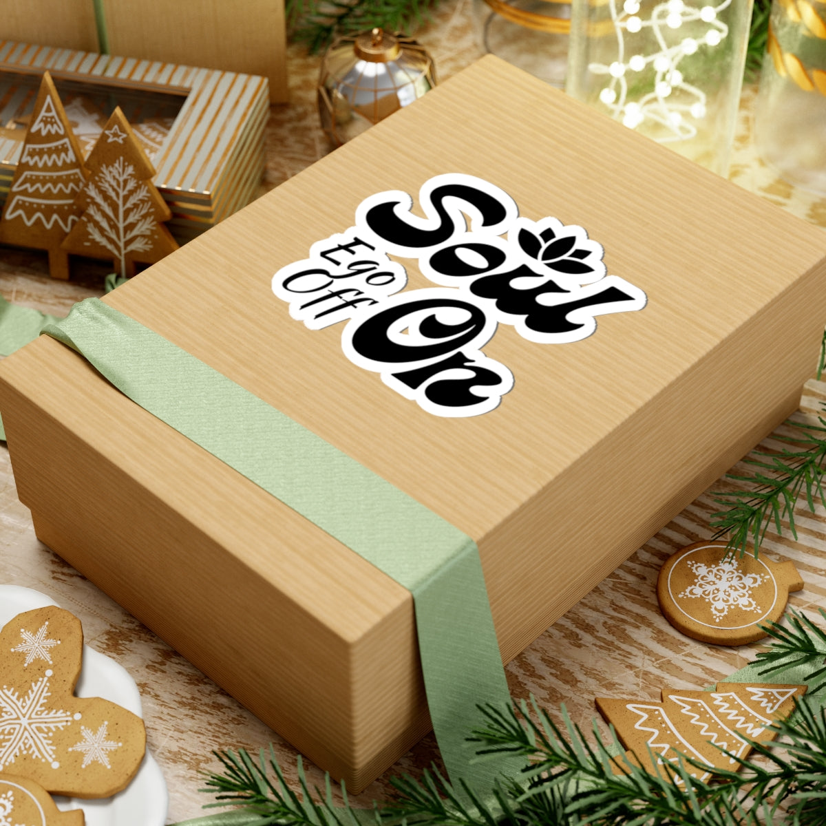 Wooden gift box with 'Sow' and 'Off' text, green ribbon, Christmas-themed background