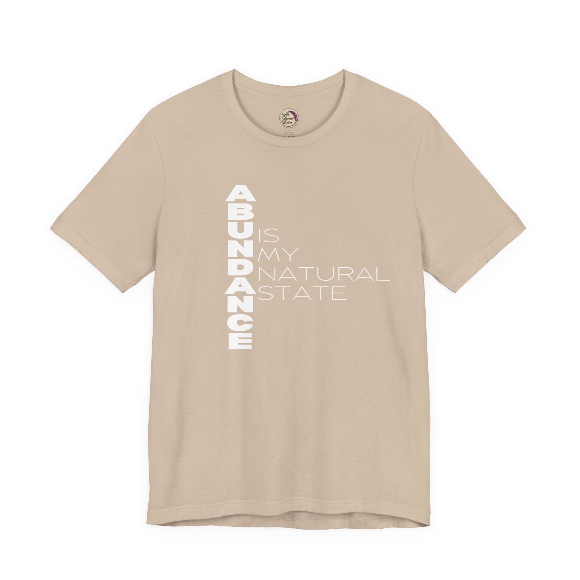 Beige t-shirt with 'ABUNDANCE IS MY NATURAL STATE' text on a white background