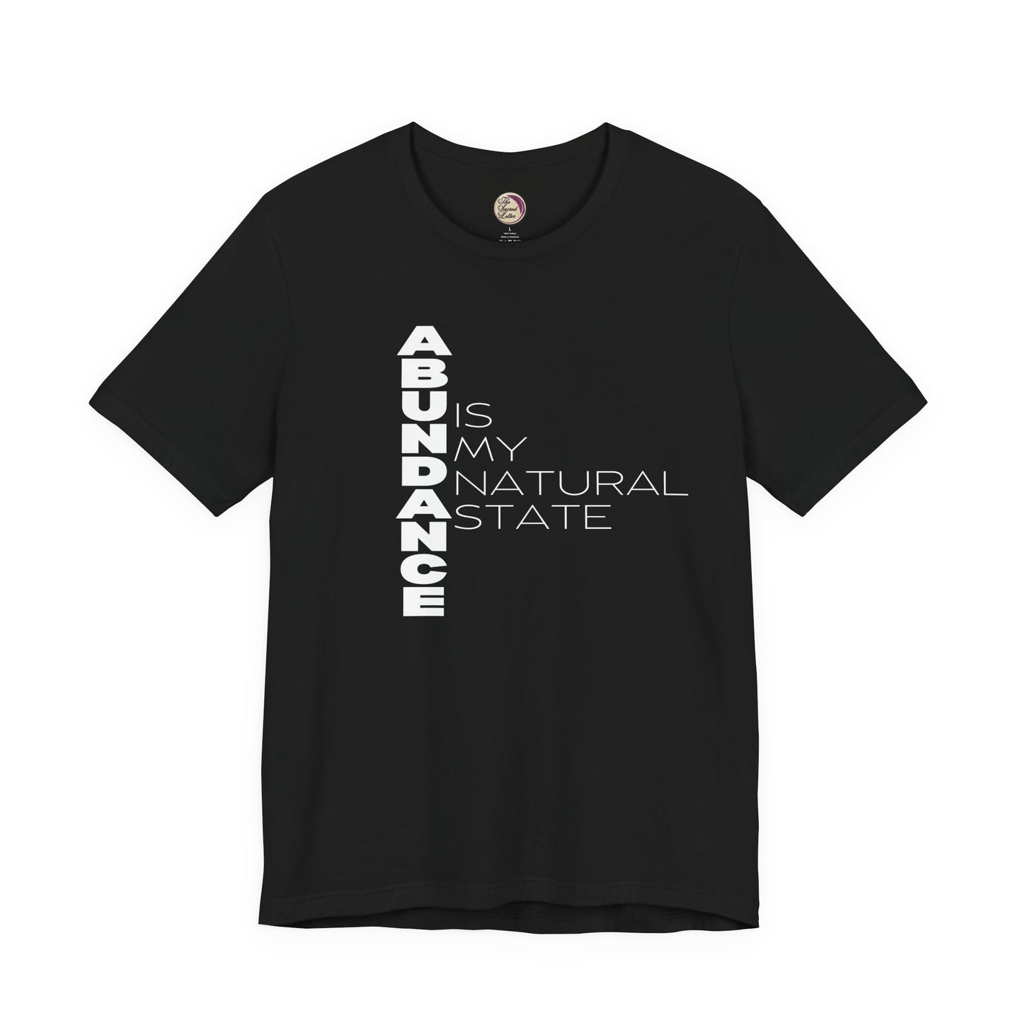 Black t-shirt with 'ABUNDANCE IS MY NATURAL STATE' text on a white background