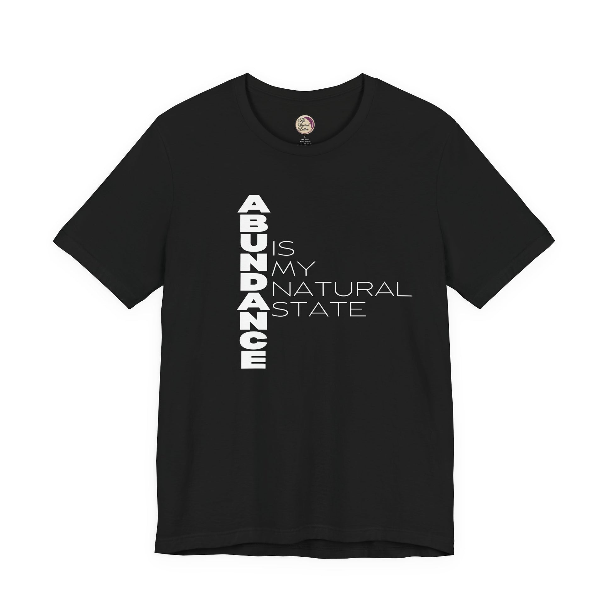 Black t-shirt with 'ABUNDANCE IS MY NATURAL STATE' text on a white background