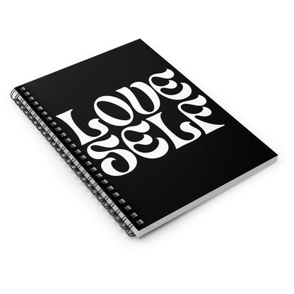 Black notebook with 'LOVE YOURSELF' text on a white background