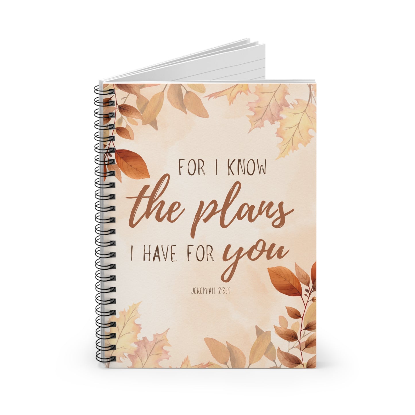 Notebook with autumn leaf design and motivational quote on a white background