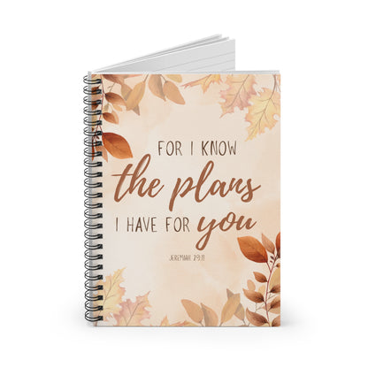 Notebook with autumn leaf design and motivational quote on a white background