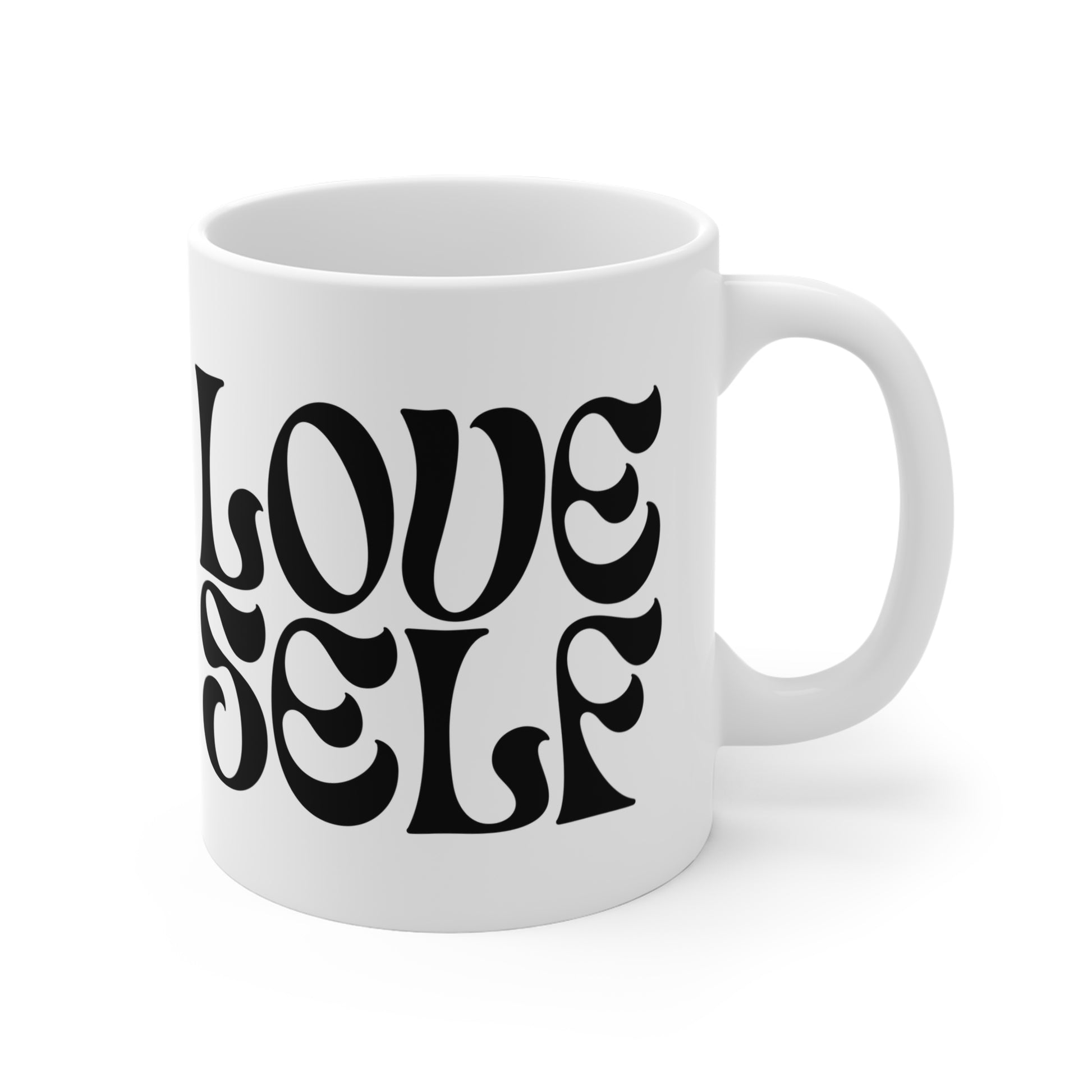 White mug with 'LOVE SELF' text in black on a white background