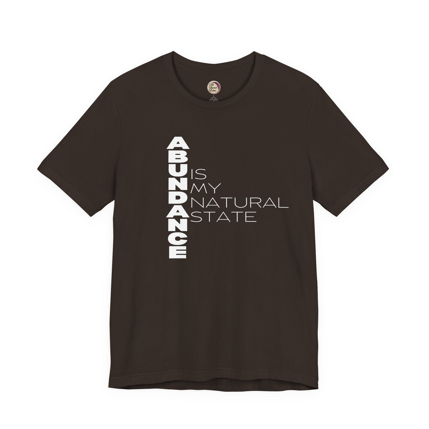 Brown t-shirt with white text 'ABUNDANCE IS MY NATURAL STATE' on a white background
