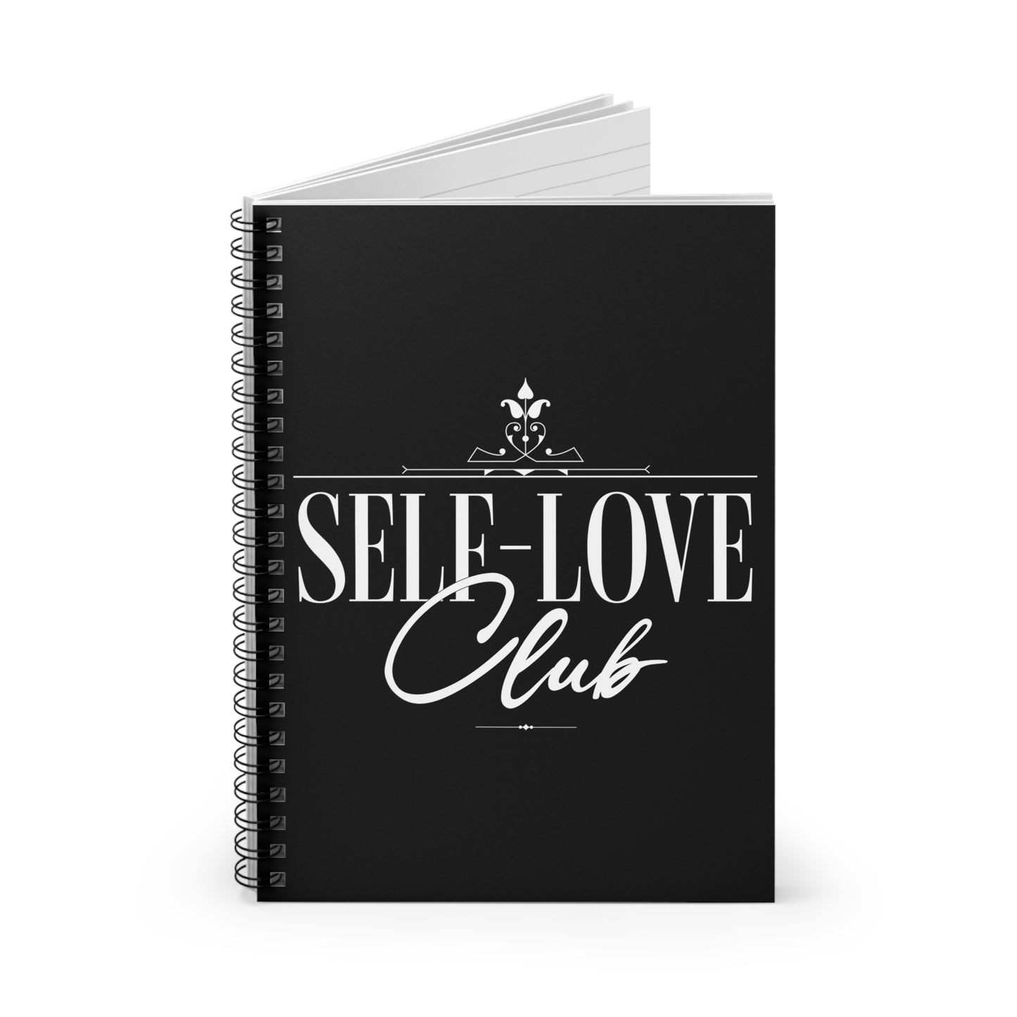 Black notebook with 'Self-Love Club' text on a white background