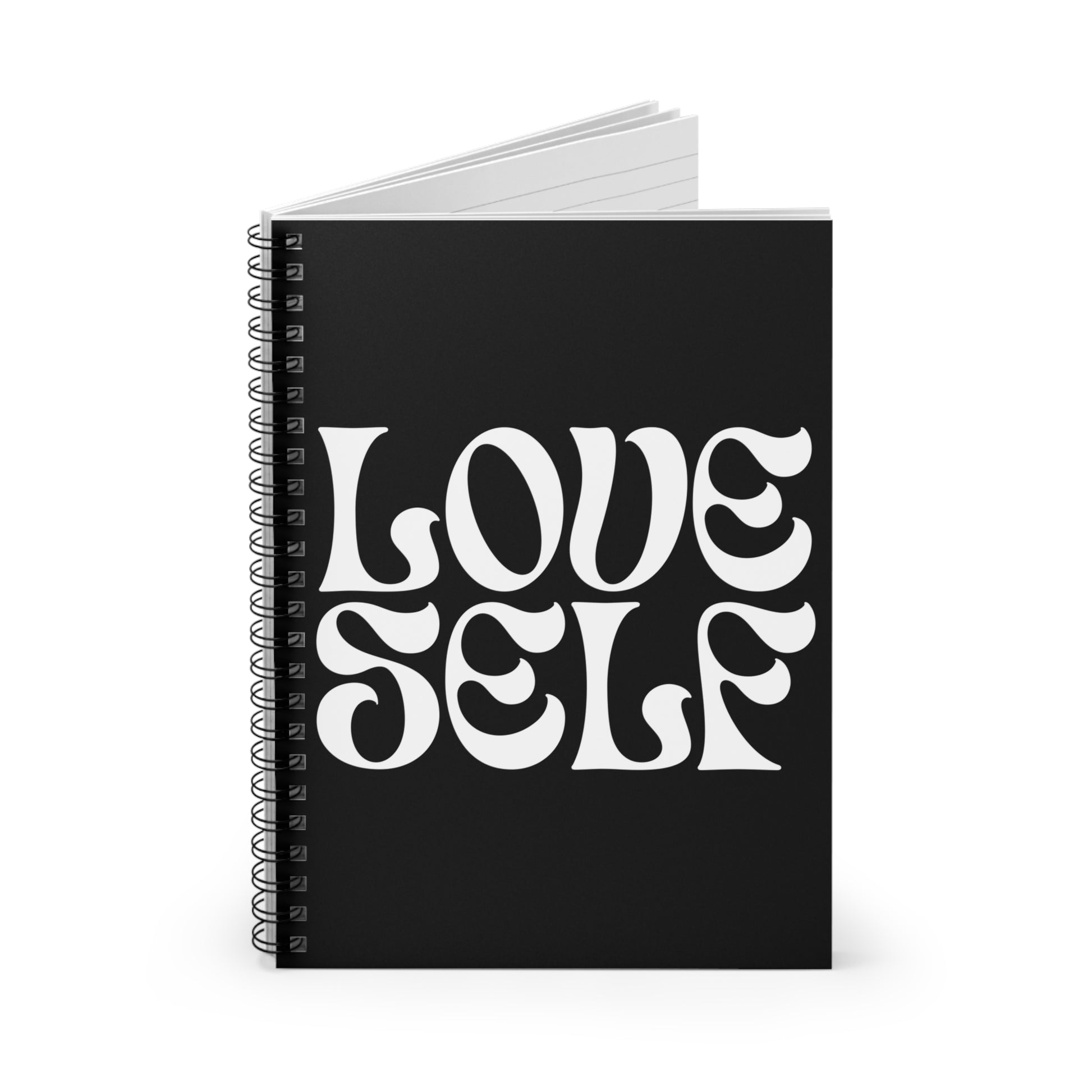Black notebook with 'LOVE SELF' text on a white background