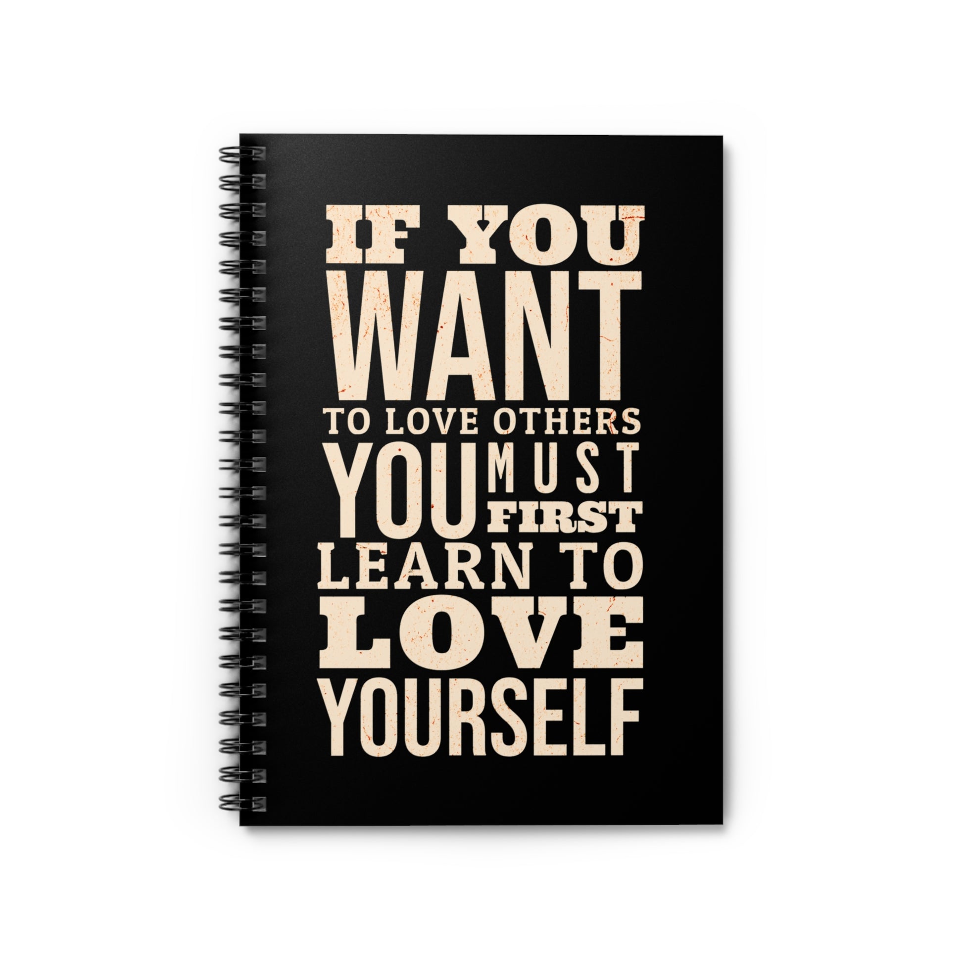Black notebook with motivational quote on a white background