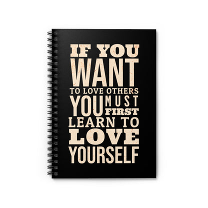 Black notebook with motivational quote on a white background