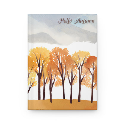 Notebook cover with autumn trees and 'Hello Autumn' text on a white background