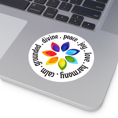 Colorful sticker with a flower design and text on a laptop