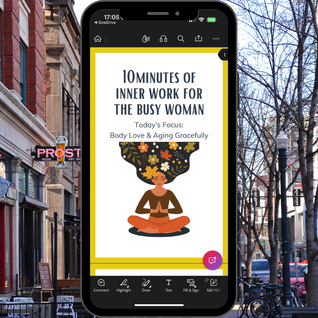 Phone screen displaying a meditation app with a city street in the background