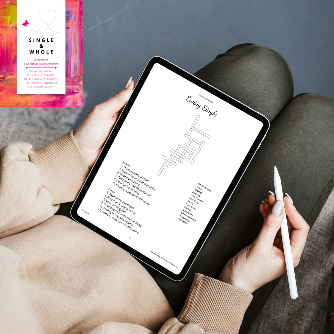Person holding a tablet with a crossword puzzle on a couch, with a book titled 'Single & Whole' in the corner.
